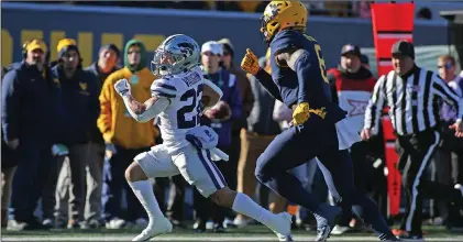  ?? (AP PHOTO/KATHLEEN BATTEN) ?? The second spot in the Championsh­ip Game will come down to the final weekend. Kansas State can clinch the spot with a win or a Texas loss. Texas can clinch with a win and a K-State loss as UT would hold the tiebreaker based on the head-to-head result.