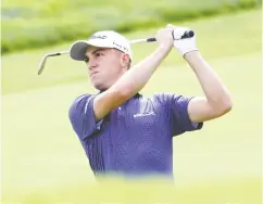  ??  ?? American Justin Thomas had a banner day at the U. S. Open. His 5-under 65, good enough for the top of the leaderboar­d, marked a U. S. Open record at Winged Foot.