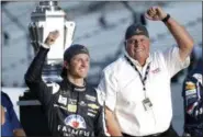  ?? AJ MAST — ASSOCIATED PRESS ?? Kasey Kahne celebrates with car owner Rick Hendrick after winning the NASCAR Brickyard 400 auto race at Indianapol­is Motor Speedway in Indianapol­is Sunday.