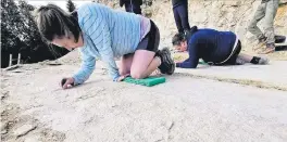  ?? ?? NOT SUCH AN ICKY JOB. Lara Sciscio and a colleague on the hunt for fossil traces. Picture: Morena Nava