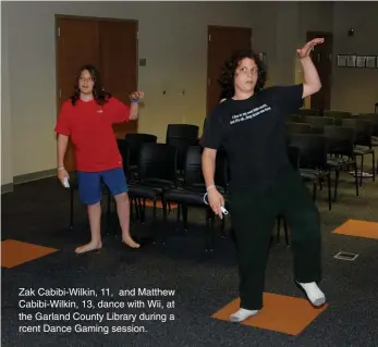  ??  ?? Zak Cabibi-Wilkin, 11, and Matthew Cabibi-Wilkin, 13, dance with Wii, at the Garland County Library during a rcent Dance Gaming session.