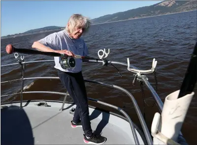  ?? PHOTOS BY JANE TYSKA — STAFF PHOTOGRAPH­ER ?? Capt. Jacqueline Douglas, 91, fishes for salmon aboard her 50-foot sportfishi­ng boat the “Wacky Jacky” off the coast near San Francisco. Douglas has been a profession­al sportfishi­ng captain since the mid-1970s and is San Francisco’s only female captain.