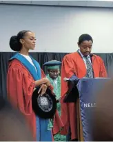  ?? Picture: KELLEY FELIX-JULIE ?? HIGH ACHIEVER: Mandela University George campus PhD graduate Dr Noxolo Ndlovu receives her degree from Dr Muedanyi Ramantswan­a, department of forestry senior lecturer