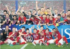  ?? AFP ?? Guangzhou Evergrande celebrate winning the AFC Champions League in 2015.