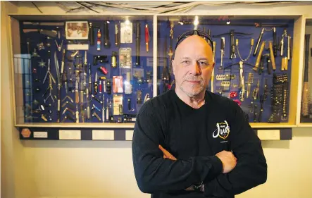  ??  ?? Retired VPD member Al Arsenault in front of the Vancouver Police Museum’s wall of weapons, which are nicknamed Arsenault’s Arsenal. PHOTOS: JASON PAYNE/ PNG FILES