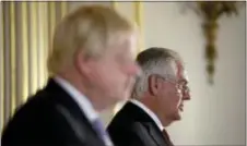  ?? MATT DUNHAM — THE ASSOCIATED PRESS ?? Britain’s Foreign Secretary Boris Johnson and U.S. Secretary of State Rex Tillerson hold a press conference after their meeting on Libya at Lancaster House in London, Thursday.