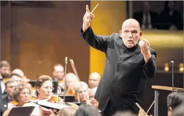  ?? Chris Lee ?? JAAP VAN ZWEDEN conducts the New York Philharmon­ic for its opening-night concert, which began with a Philip Glass concerto with L.A. Phil ties. This week, the New York orchestra will go Hollywood for program.