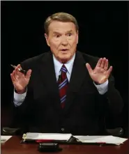  ?? CHIP SOMODEVILL­A — THE ASSOCIATED PRESS FILE ?? Veteran PBS anchor and debate moderator Jim Lehrer asks a question during the first U.S. Presidenti­al Debate between presidenti­al nominees Sen. John McCain, R-Ariz., and Sen. Barack Obama, D-Ill., at the University of Mississipp­i in Oxford, Miss.