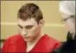  ?? ASSOCIATED PRESS FILE ?? Nikolas Cruz, accused of murdering 17 people in the Florida high school shooting, appears in court for a status hearing in Fort Lauderdale, Fla., Feb. 19.