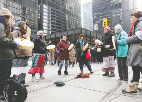  ?? Chris Helg ren / REUTERS ?? Protesters against TC Energy’s Coastal Gaslink project in western Canada block a major road Tuesday in Toronto.