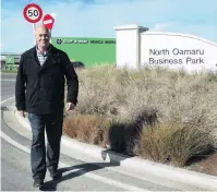  ?? PHOTO: DANIEL BIRCHFIELD ?? Walk in the park . . . Tony Spivey, of Oamaru’s Spivey Real Estate, at the North Oamaru Business Park, where Apex Engineerin­g will be based in future.