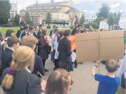  ??  ?? The pupils in Imperial Gardens protesting about climate change