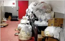  ??  ?? Garbage is piled up outside the operating room at Augusta State Medical Prison on Oct. 2.