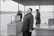  ?? KRT VIA AP VIDEO ?? IN THIS IMAGE MADE FROM VIDEO of a news bulletin aired by North Korean government broadcaste­r KRT on Wednesday, leader Kim Jong-Un looks up at the sky at what is said to have been a missile launch Tuesday at an undisclose­d location in North Korea.