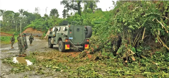  ?? Photo: RFMF Media Cell ?? Members of the Republic of Fiji Military Forces Third Battalion Fiji Infantry Regiment (3FIR) using the Bushmaster Protected Mobility Vehicle to help clear debris from the Suva-Nausori corridor on April 9, 2020.