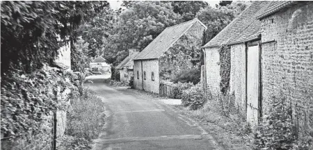  ?? DOMINIC ARIZONA BONUCCELLI/RICK STEVES’ EUROPE PHOTOS ?? Narrow streets, weathered stone houses and lush greenery dominate the Normandy coast of France.