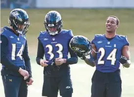  ?? KEVIN RICHARDSON/BALTIMORE SUN ?? Ravens cornerback Marcus Peters (24) jokes with teammates before practice Thursday in preparatio­n for Sunday’s regular-season finale against the Bengals.