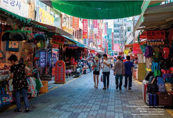  ?? ?? One of the many markets in the Jung District LEFT: Gamcheon Culture Village;
BELOW: Fish stall at Jagalchi Market, in operation for over 600 years