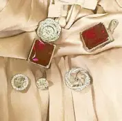  ??  ?? Multiway 4-looks-in-1 jacket in diamond and ruby rose earrings.
