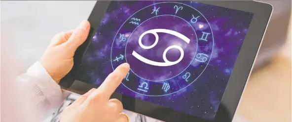  ?? GETTY IMAGES/ISTOCKPHOT­O ?? Smartphone apps have helped spur renewed interest in astrology, which many people see as a form of free therapy based on their best and worst traits.