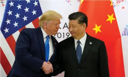  ?? Photograph: Kevin Lamarque/Reuters ?? Donald Trump and Xi Jinping during the G20 leaders summit in Osaka, Japan in 2019.