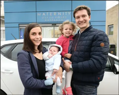  ??  ?? Fabien and his wife Typhaine with baby Oscar and Aliona, 3, and below, the hospital has now improved entrance signs