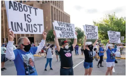  ?? Photograph: Suzanne Cordeiro/AFP/Getty Images ?? People rally to support voting rights at the Texas state capitol in Austin.