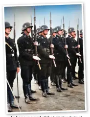  ??  ?? An honour guard of the Leibstanda­rte at Berlin’s Tempelhof Airport on 24 March 1934 in the original all-black uniform (Bruce Quarrie)
