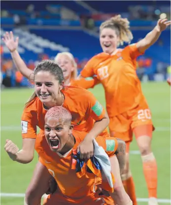  ?? AP PHOTO ?? Dutch players celebrate after winning the Women’s World Cup semifinal soccer match against Sweden at the Stade de Lyon outside Lyon, France, on Wednesday.