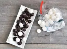  ??  ?? Meringues in a basic truffle ganache, or what we lovingly call “rabbit poop.”