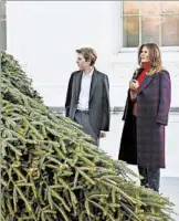  ?? OLIVIER DOULIERY/ABACA PRESS ?? First lady Melania Trump and son Barron greet the official White House Christmas tree on Monday.