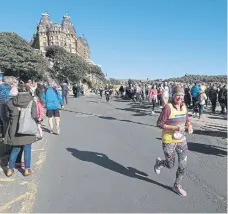  ?? ?? Avril Metcalfe, of Scarboroug­h AC, heads to the finishing line