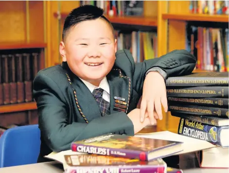  ??  ?? > Schoolboy Toby Liu achieved an impressive IQ score of 160, said to be similar to that of Einstein and Stephen Hawking, left