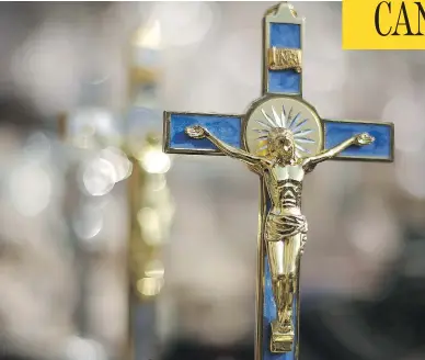  ?? PETER MACDIARMID / GETTY IMAGES ?? A crucifix on display in Vatican City. The decision of Saint-Sacrament Hospital in Quebec City to remove — then restore — its own crucifix has stirred up debate in Quebec over the public display of religious imagery.