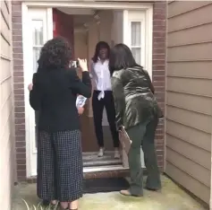  ?? — @oprah/Reuters photo ?? Oprah Winfrey (right) greets a resident during a trip to Georgia to help canvas for Democratic gubernator­ial candidate Stacey Abrams on Thursday, in this still image taken from video obtained from social media.