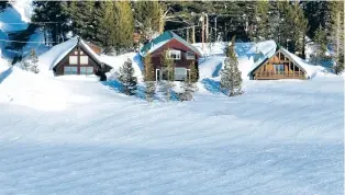  ?? JOSH EDELSON/THE WASHINGTON POST ?? Homes are seen buried in snow Thursday in Soda Springs, Calif. The amount of snow that has fallen on California is rivaling some of the most bountiful years on record.