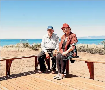  ??  ?? Jean and Bruce MacHardy now enjoy sea views from the deck of their relocated red-zoned home in Golden Bay. Jean said she found it ‘‘heartbreak­ing to see so many beautiful houses demolished when people were living in cars’’.