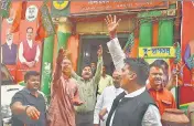  ?? ?? BJP activists celebrate their party's victory in Tripura Municipal Elections outside state party office in Kolkata on Sunday.