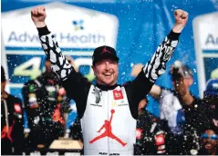  ?? COLIN E. BRALEY/ASSOCIATED PRESS ?? Kurt Busch celebrates in victory lane after winning a NASCAR Cup Series auto race at Kansas Speedway in Kansas City, Kansas, on Sunday. It was Busch’s first career win at the track.