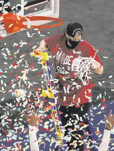  ?? Morry Gash / Associated Press ?? Players toss confetti in the air as Stanford head coach Tara VanDerveer cuts down the net.