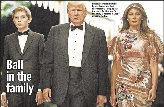  ??  ?? President Trump is flanked by son Barron and First Lady Melania Trump as the trio arrive for New Year’s Eve party at his Mar-a-Lago resort in Florida.