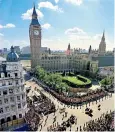  ??  ?? Standing together: Diana’s coffin is placed into the hearse, top; Elton John performs, right; a view of the funeral cortège, above