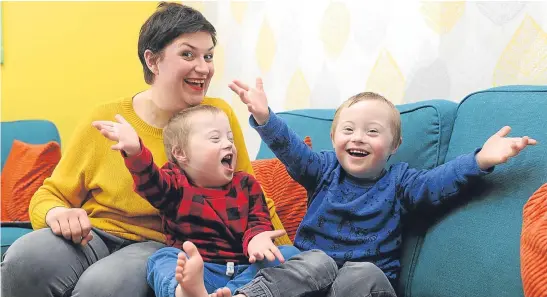  ??  ?? Mum Elaine Scougal with her twin boys, Cameron and Ollie, right.