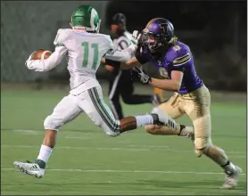  ?? BEA AHBECK/NEWS-SENTINEL ?? Tokay's Colby Baker pursues St. Mary's Dumaurier Cotton during their Tri-City Athletic League game at the Grape Bowl on Friday.