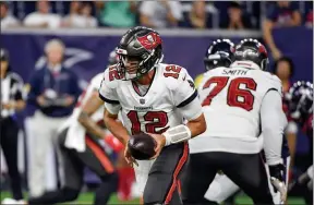  ?? JUSTIN REX — THE ASSOCIATED PRESS ?? Buccaneers quarterbac­k Tom Brady hands off during a preseason game against the Texas in Houston.