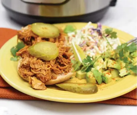  ?? KARON LIU PHOTOS/TORONTO STAR ?? Cut down on time by cooking barbecue pulled chicken in an Instant Pot. The recipe will make enough to last the rest of the week.