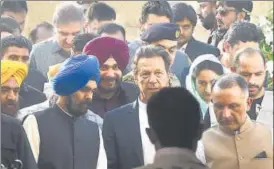  ?? AFP ?? ▪ Punjab cabinet minister Navjot Singh Sidhu and Union minister for food processing industries Harsimrat Kaur Badal with Pakistan Prime Minister Imran Khan (C) in Kartarpur, Pakistan, on Wednesday.