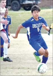  ?? Westside Eagle Observer/MIKE ECKELS ?? Decatur’s Jose Rubi (5) finds open field as he pushes toward the net during the Decatur-Life Way soccer match at Warrior Soccer Field in Centerton on April 17.