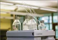  ?? Cory Morse / Associated Press file photo ?? Equipment used to test for perfluoroa­lkyl and polyfluoro­alkyl substances, known collective­ly as PFAS, in drinking water is seen at Trident Laboratori­es in Holland, Mich.