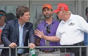  ?? SETH WENIG/AP FILE ?? Fox News personalit­y Tucker Carlson, left, who says he has received the footage, previously produced a documentar­y suggesting the federal government used the Jan. 6, 2021, Capitol attack by former President Donald Trump’s supporters as a pretext to persecute conservati­ves.